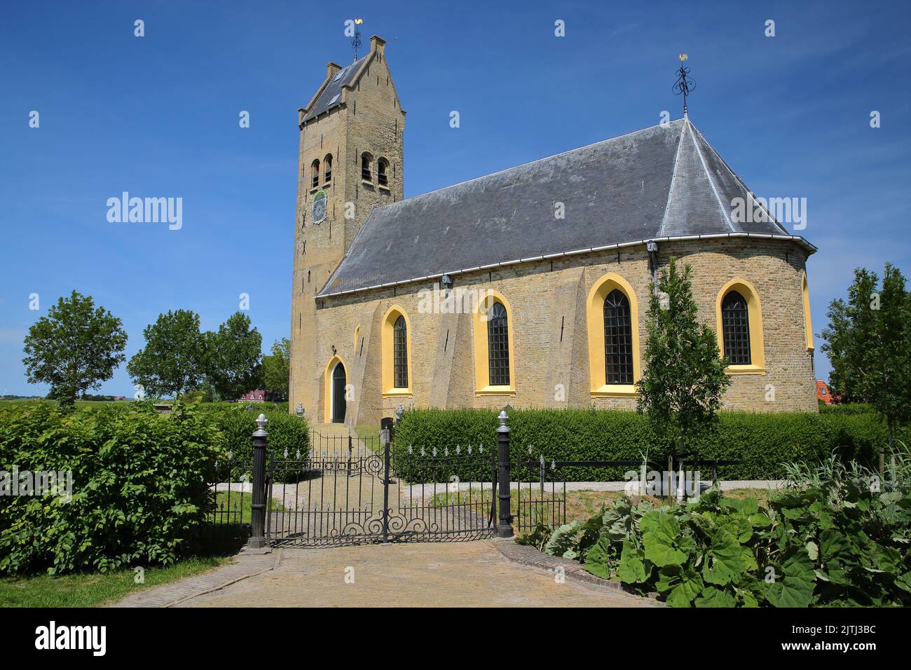 The church of Hichtum, Friesland, Netherlands, with its massive bell tower. Hichtum is a little rural village close to Bolsward Stock Photo