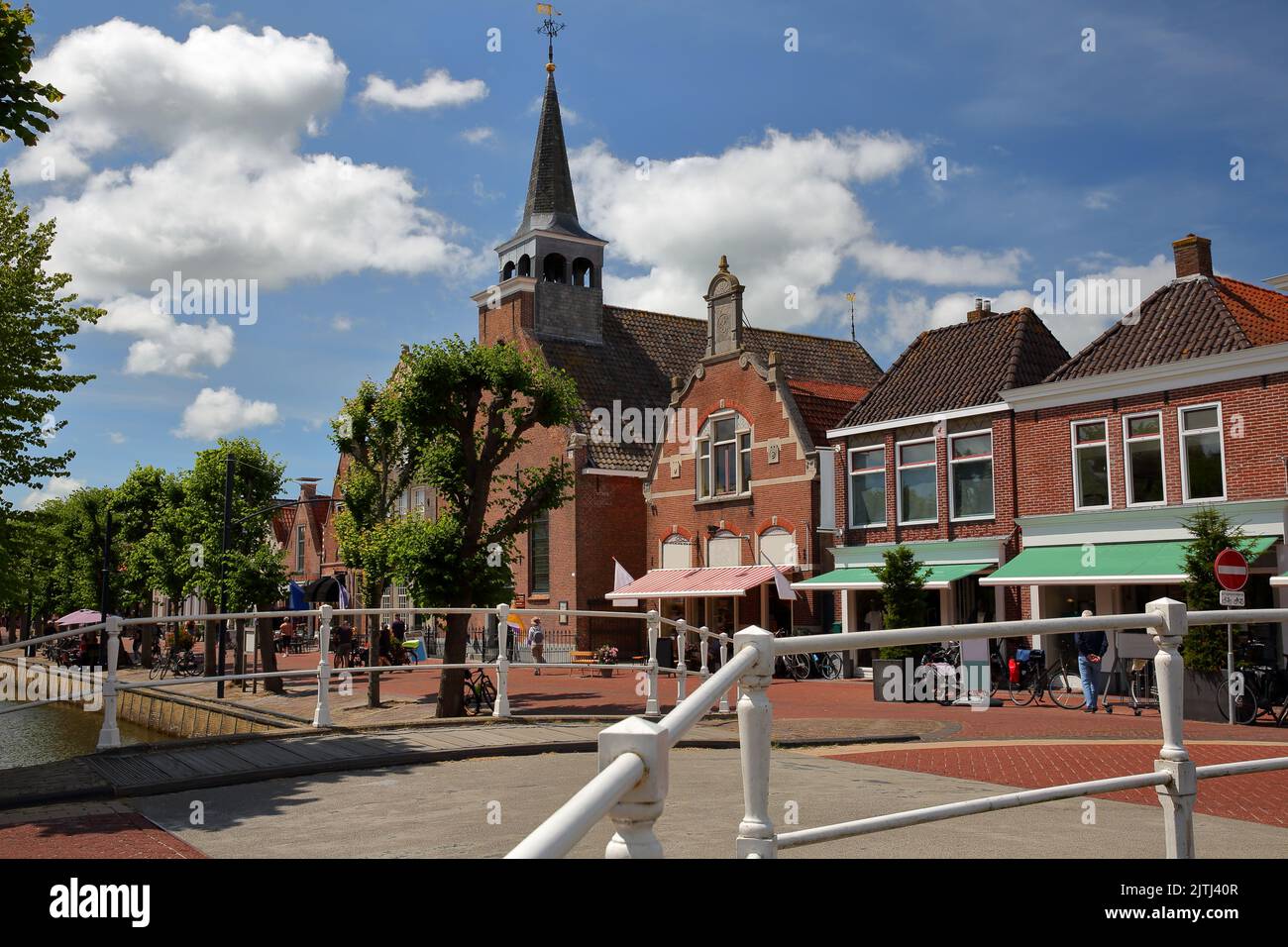 The historical center of Balk, Friesland, Netherlands, with historic houses, bridges, canals and Breahus church Stock Photo