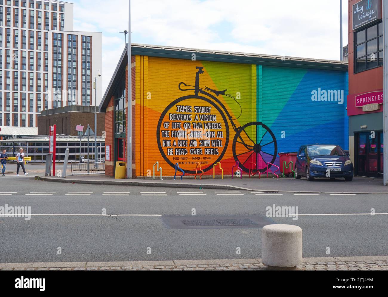 Old fashioned Penny Farthing bicycle wall mural in Coventry, UK Stock Photo