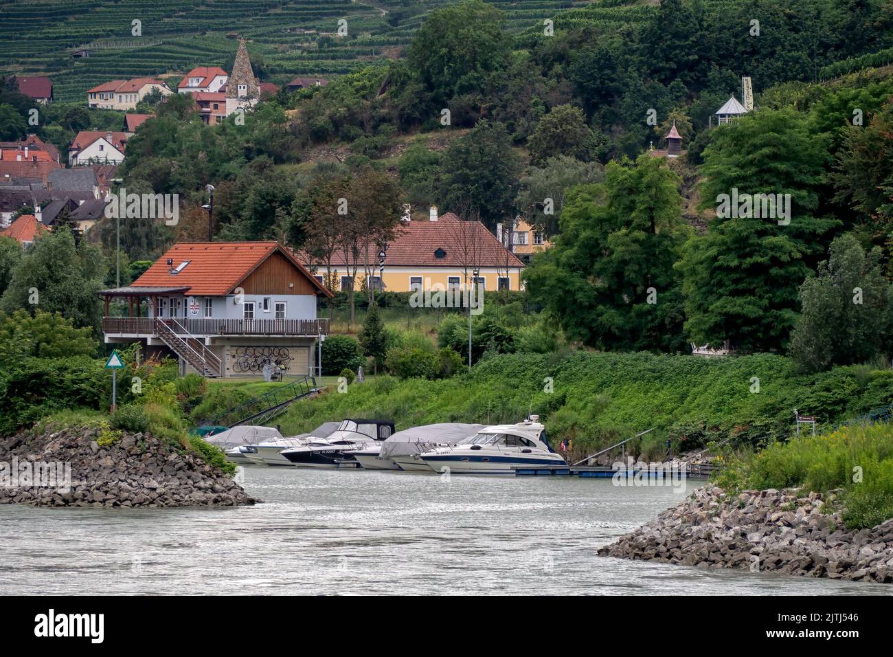 SPITZ, AUSTRIA - JULY 13, 2019:  The Spitz Water Sports Club on the River Danube  with the village in the background Stock Photo