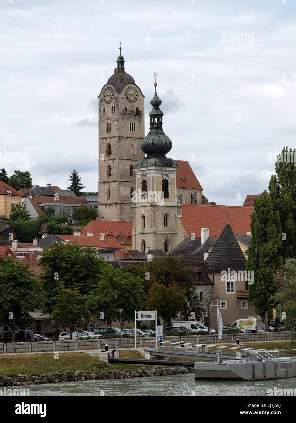 KREMS, AUSTRIA - JULY 13, 2019:  View of the town and church towers in the Old Town as seen from the Danube River Stock Photo