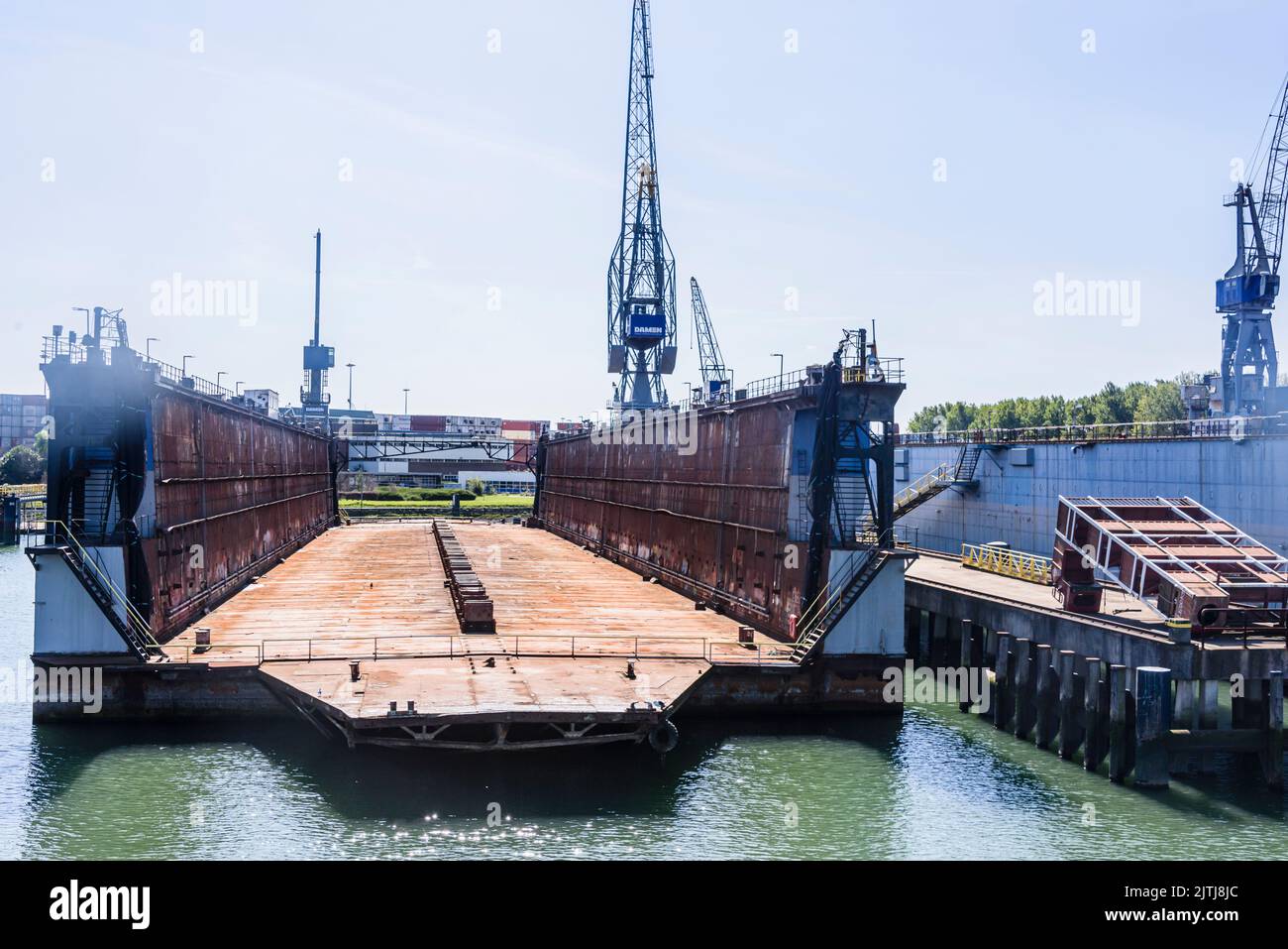 Portable barges which act as dry docks to lift boats and ships out of the water for repairs and maintenance at the Port of Rotterdam, Netherlands Stock Photo