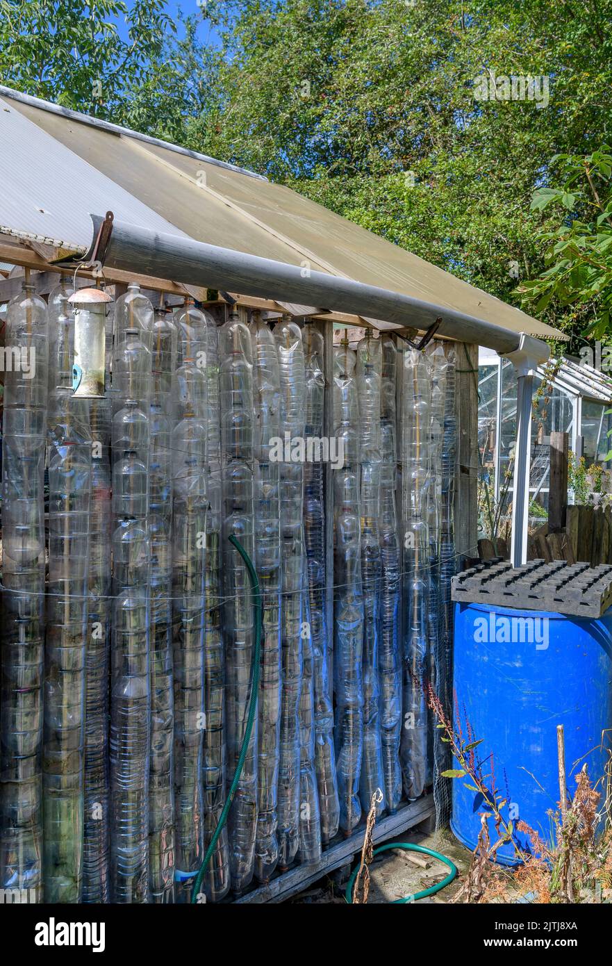 Reusing plastic bottles to create a greenhouse. Bottles are threaded on sticks. There is even water collection. Avoncroft Museum of Historic Buildings Stock Photo