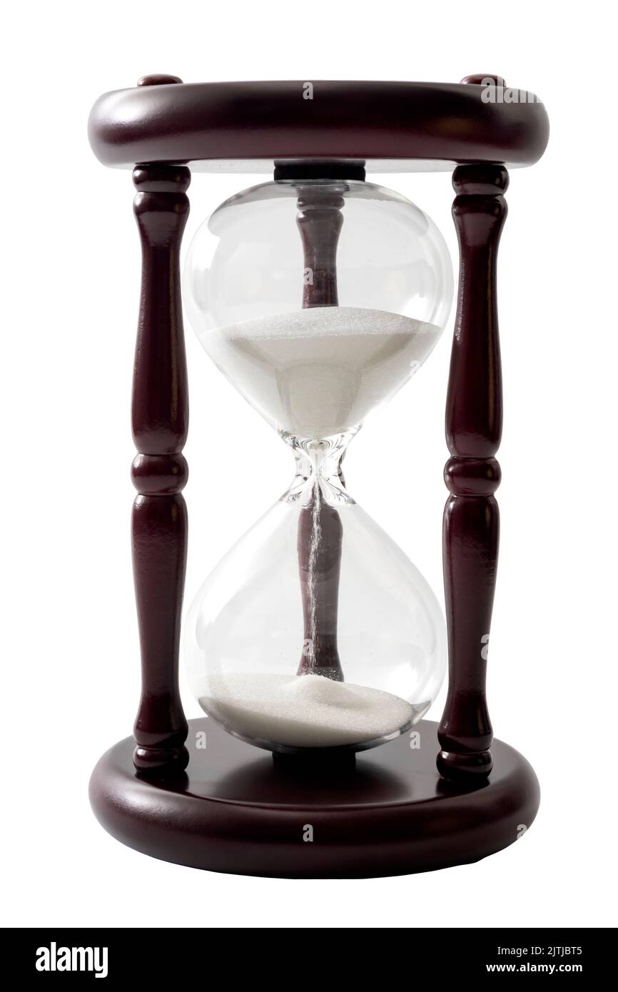 Sand flowing in transparent hourglass used to measure the passing of time, isolated on white background with clipping path cutout concept for countdow Stock Photo