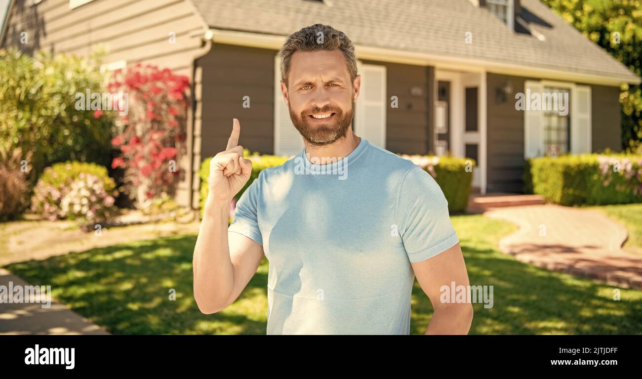 happy bearded man inspired with idea, real estate Stock Photo