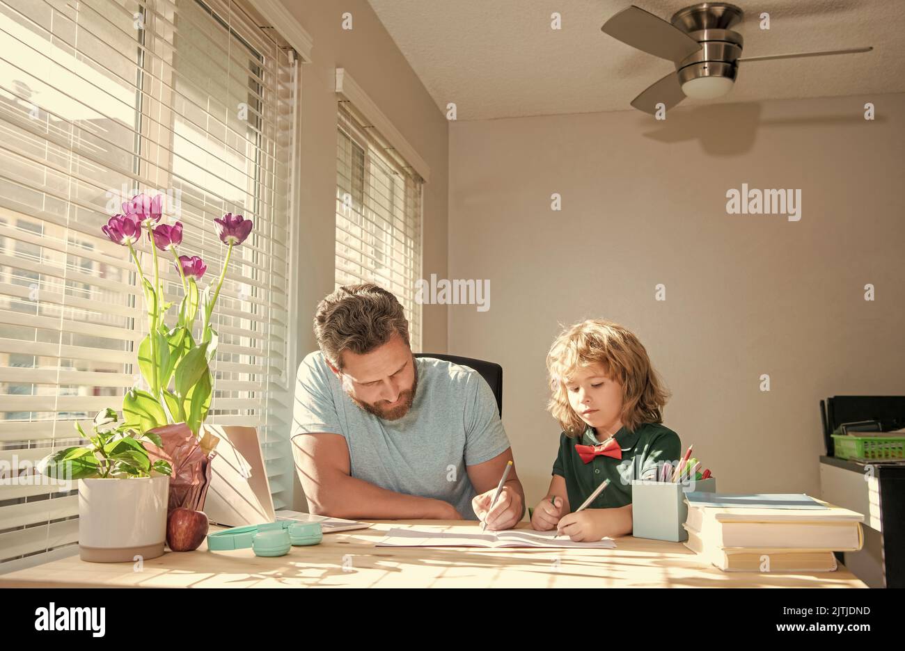 concentrated boy study with teacher. private drawing lesson. education concept. Stock Photo