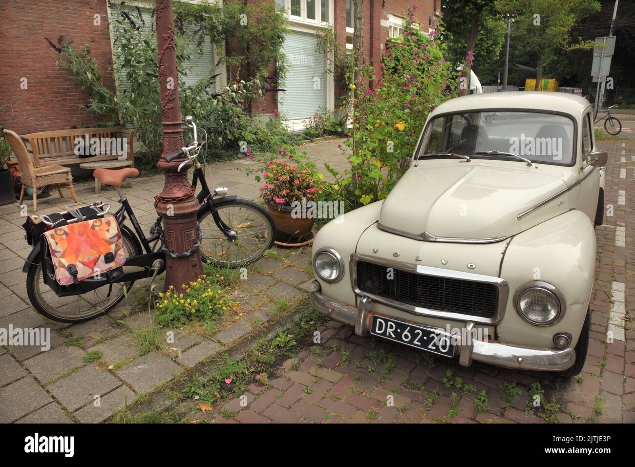Old Volvo PV544 parked in front of housing in Amsterdam, Netherlands. Stock Photo