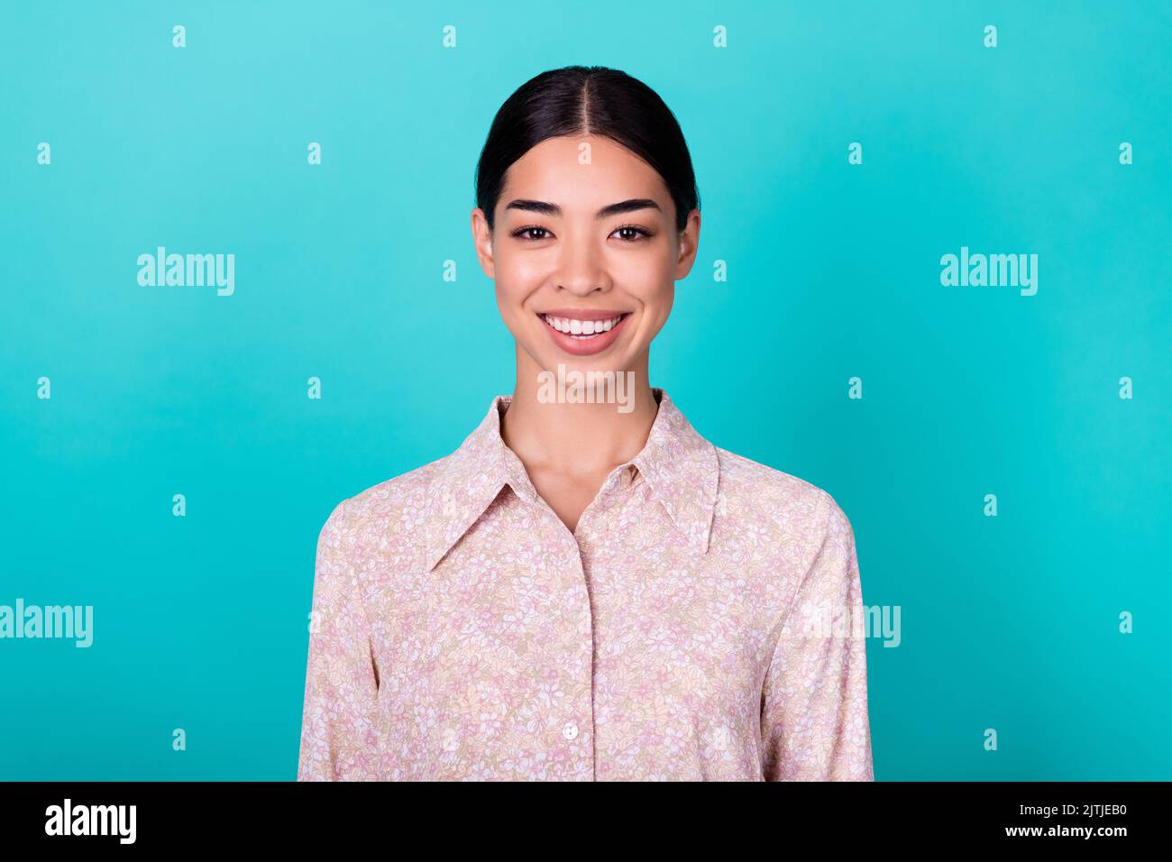 Portrait of gorgeous positive vietnamese lady toothy beaming smile isolated on bright aquamarine color background Stock Photo
