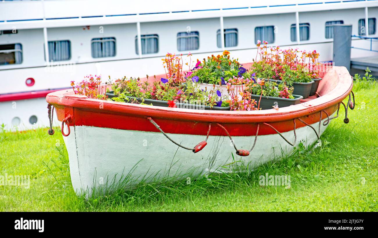 Ornamental boat with flowers in the cruise port of Saint Petersburg in the Russian Federation, Russia Stock Photo