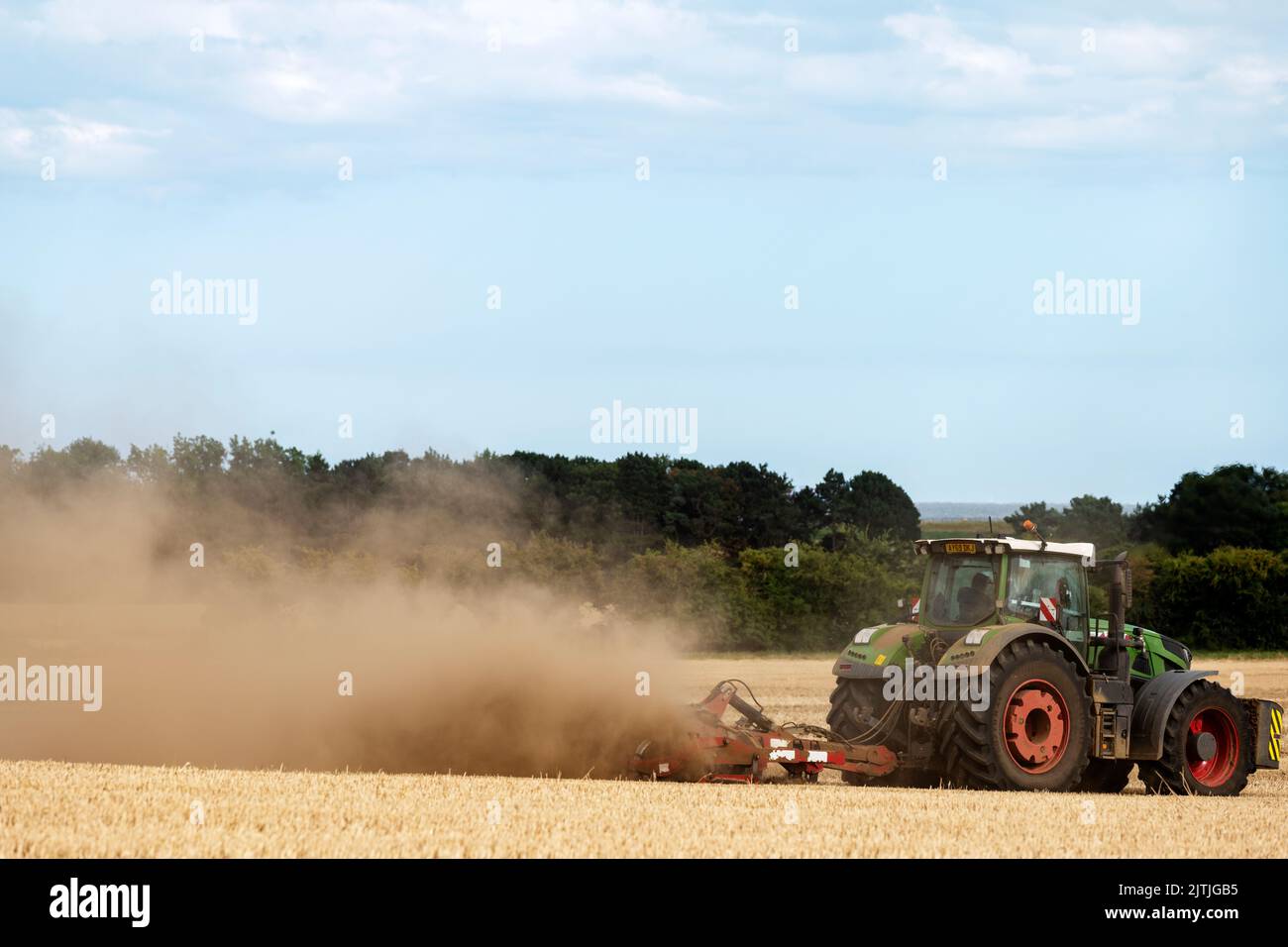 Stubble field being cultivated Bawdsey Suffolk UK Stock Photo