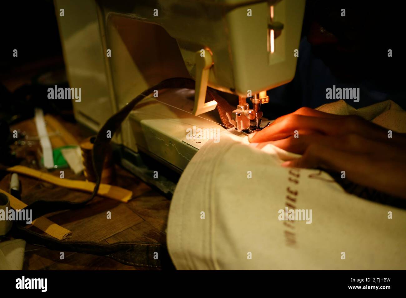 Dressmaker working sewing machine close hi-res stock photography and ...