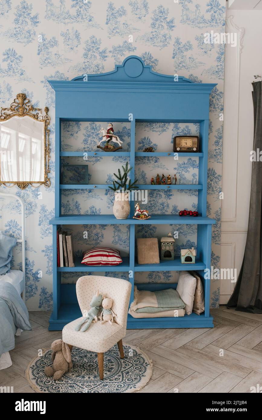 Blue wooden wardrobe in a cozy living room decorated for Christmas Stock Photo