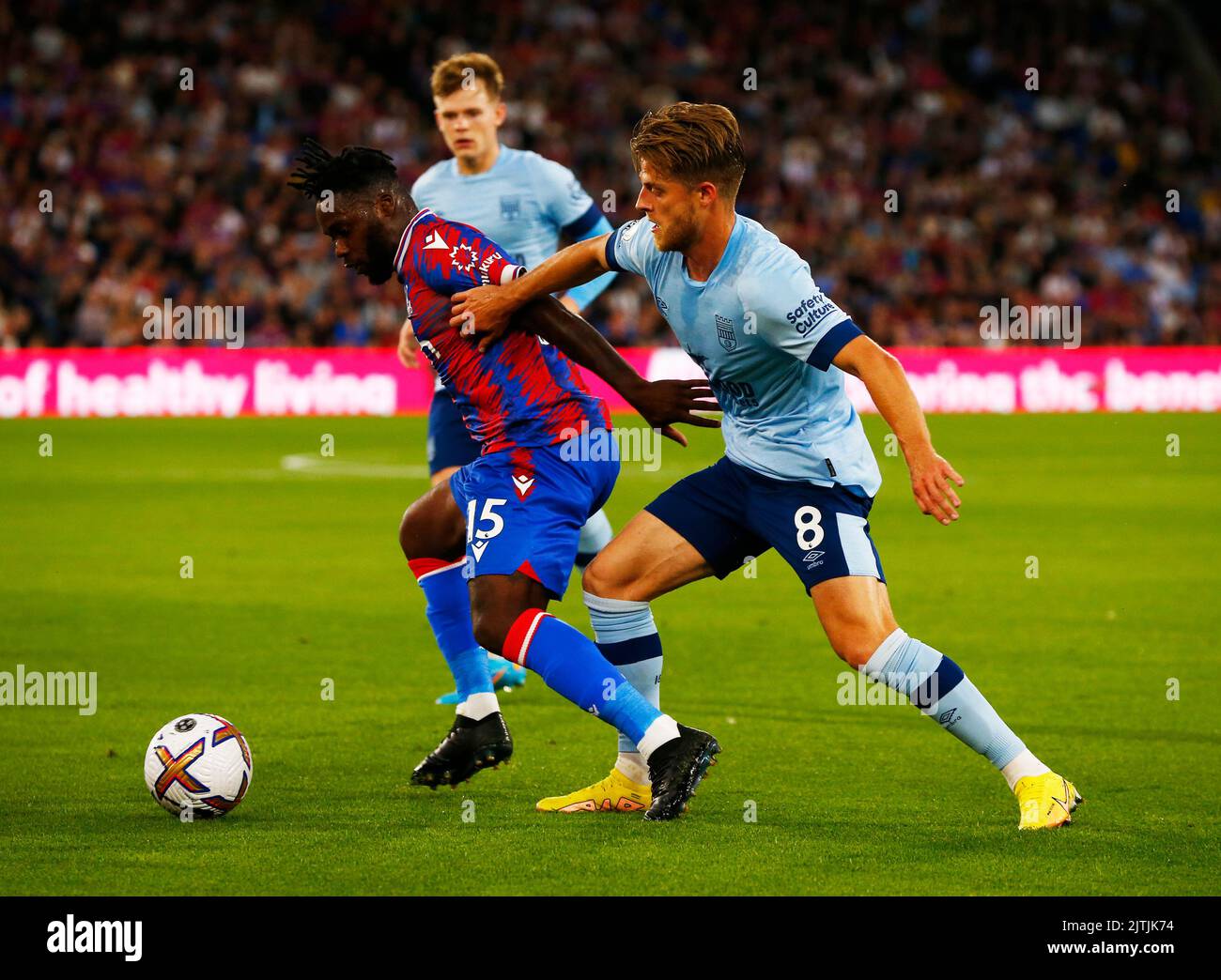 London ENGLAND - AUGUST  30 : L-R Crystal Palace's Jeffrey Schlupp and Mathias Jensen of Brentford during English Premier League match between Crystal Stock Photo