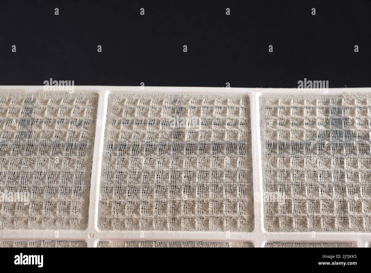 Dusty air conditioner filter. A lot of dust on the net, asthma and