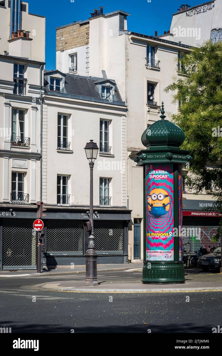 Iconic Morris Column with colourful posters advertising shows, Paris, France Stock Photo