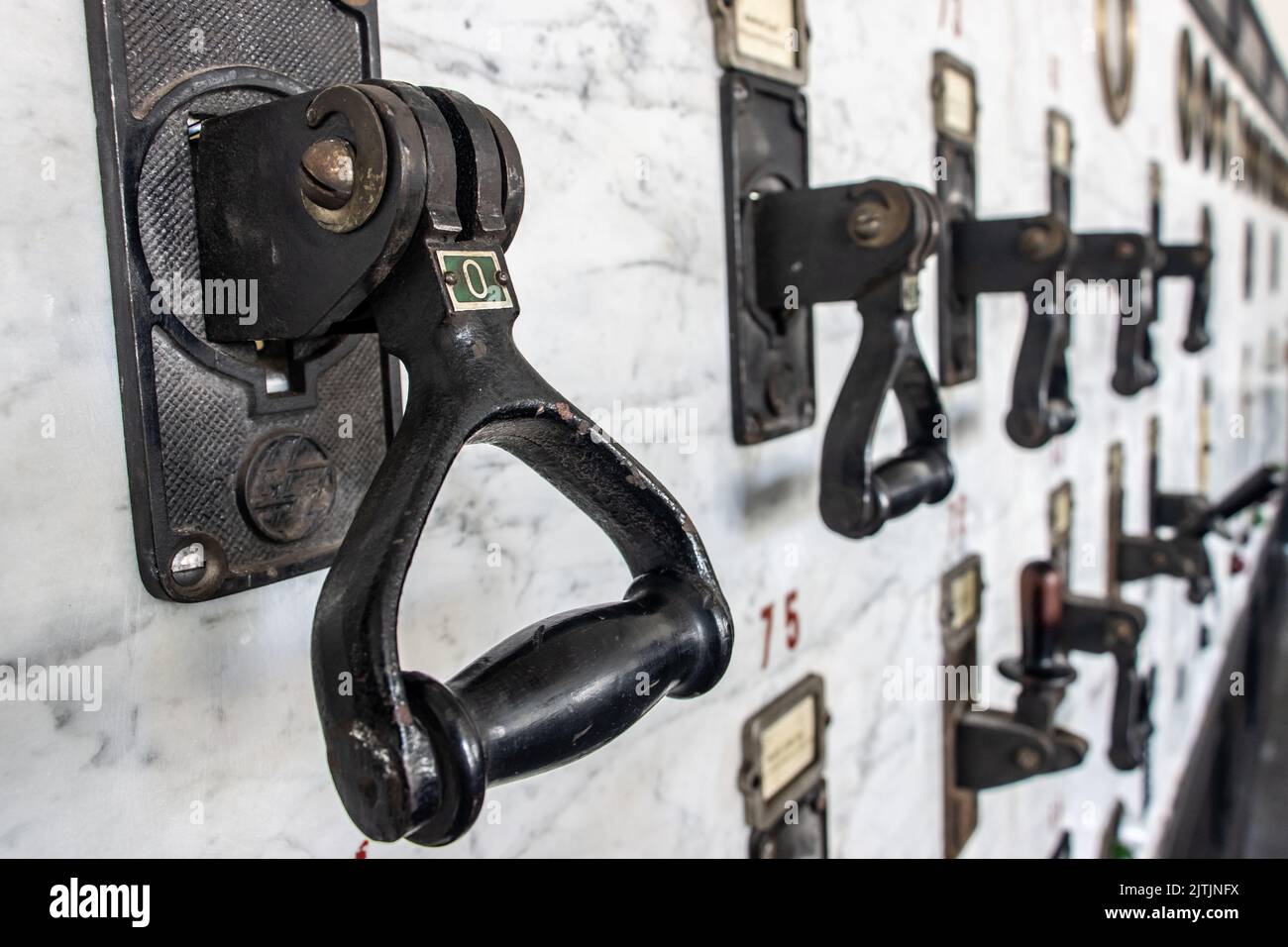 Retro electrical circuit breakers on the control panel Stock Photo