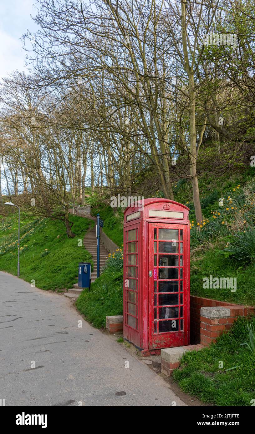 A red telephone box near the Coble Landing at Filey Stock Photo