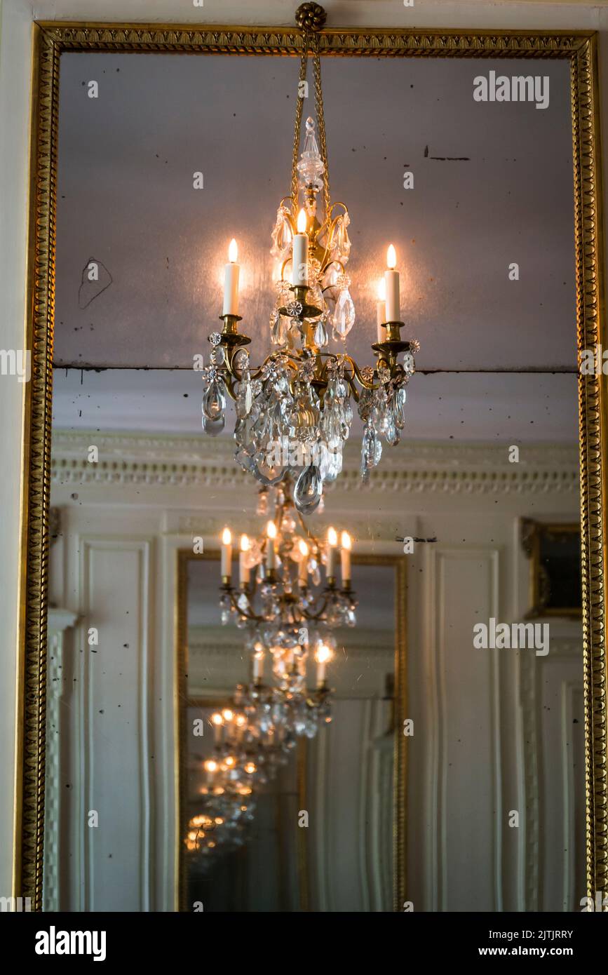 Chandelier reflected in a mirror, Carnavalet Museum, a museum dedicated to the history of the city, located in the Marais district, Paris, France Stock Photo