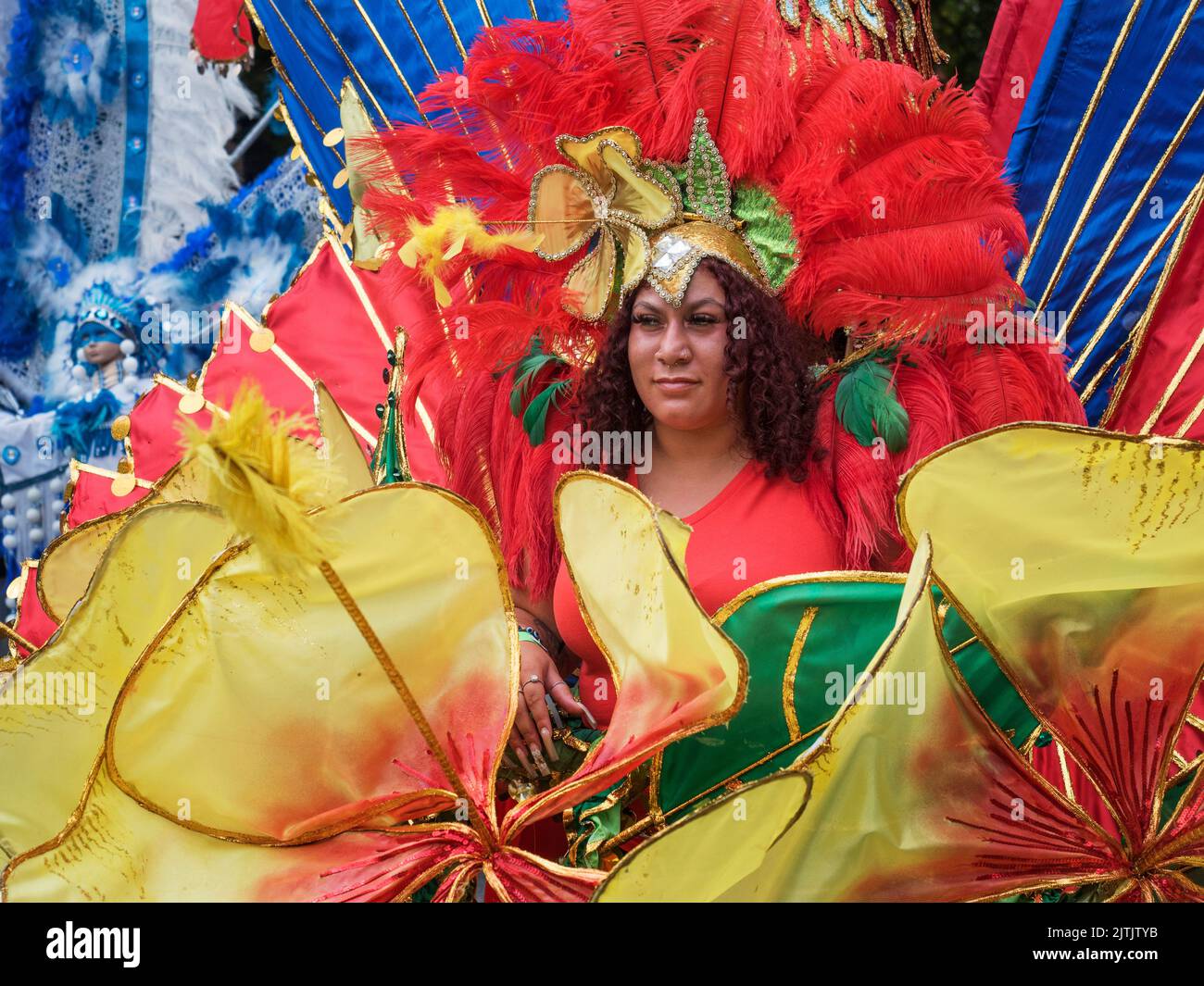 2022 August 29 - UK - Yorkshire - Leeds West Indian Carnival - Colourful trope leader in the parade on Harehills Lane Stock Photo