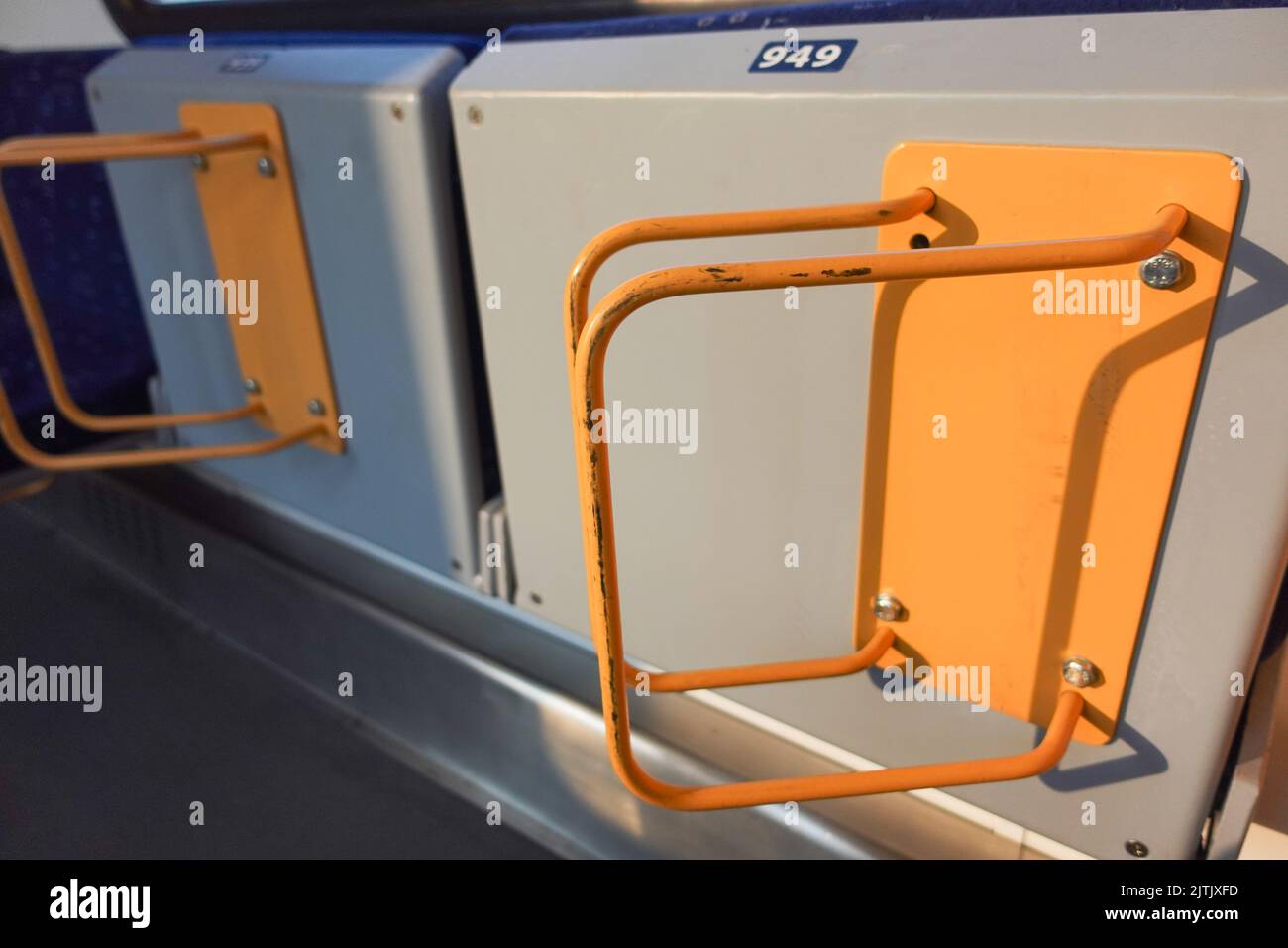 Cycle Rack Train Bicycle racks on a train separated by a shadow Stock Photo - Alamy