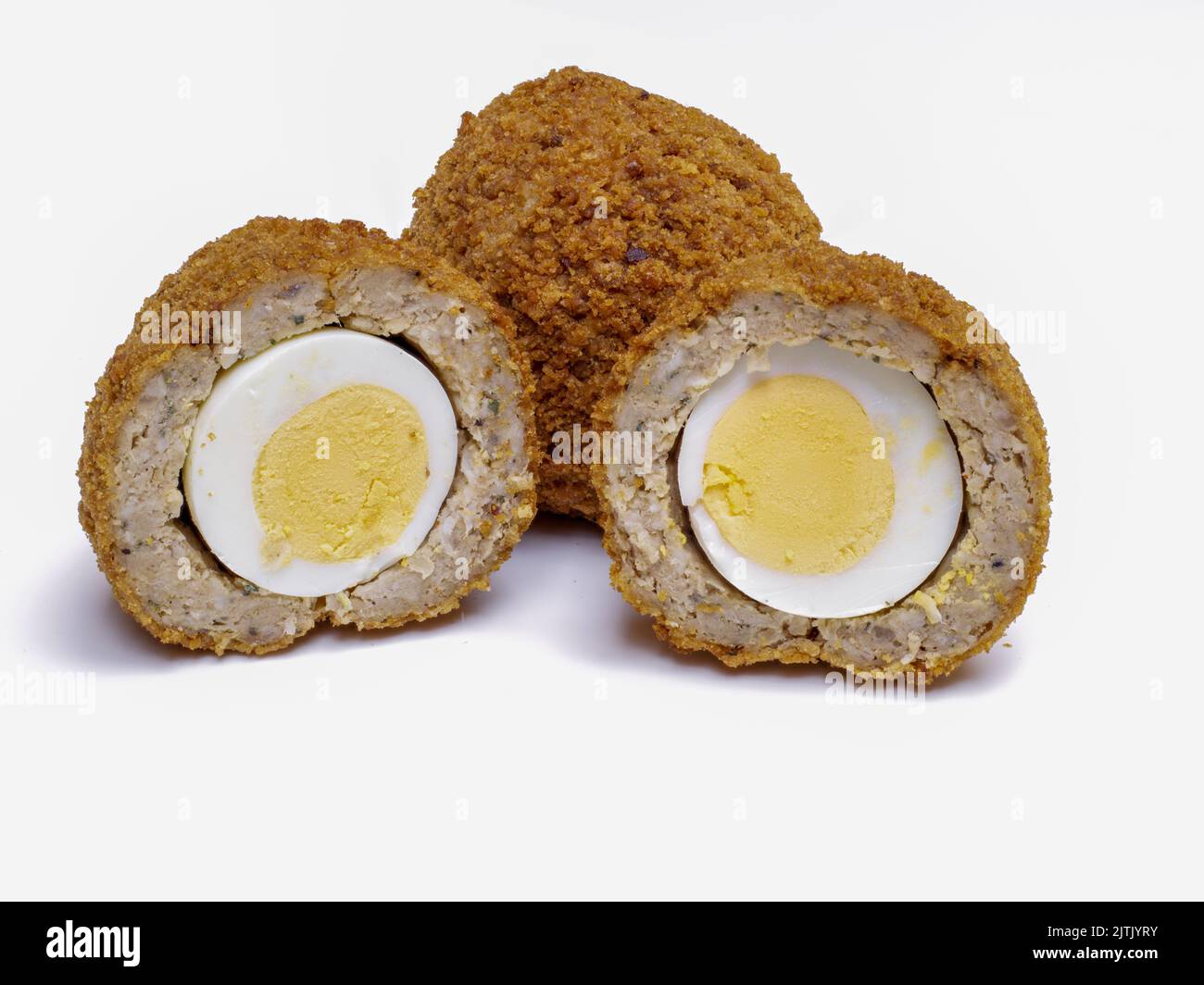Scotch Eggs  halved isolated on a white background Stock Photo