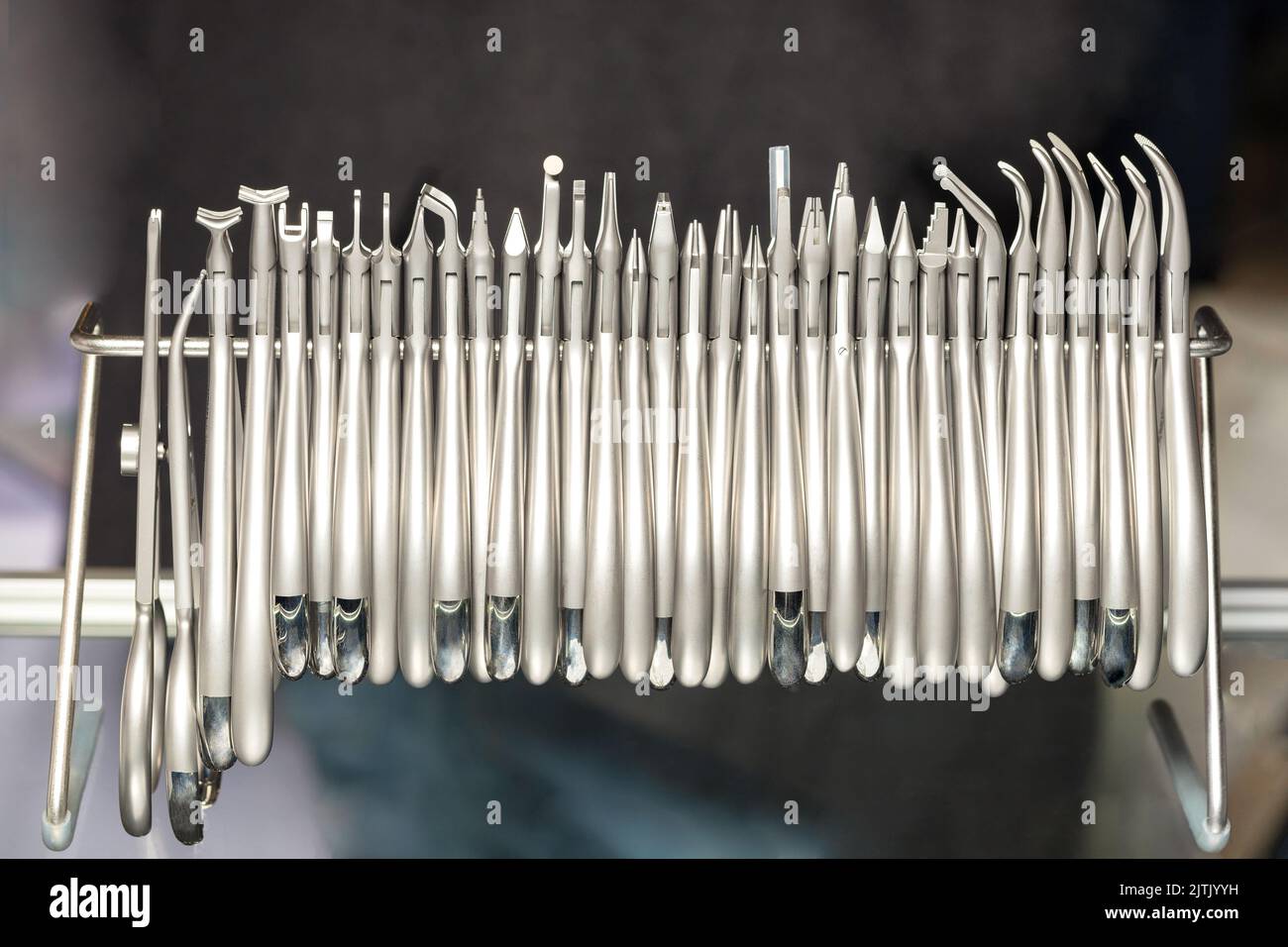 Set of various stainless steel instruments in a dental clinic. The