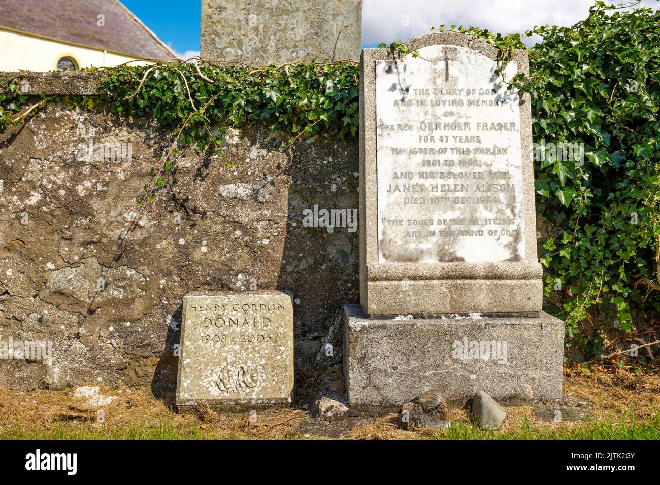 Headstones of author Henry Gordon Donald, and the Rev Denholm Fraser at Sprouston Kirk, in the Scottish Borders, Scotland, UK Stock Photo
