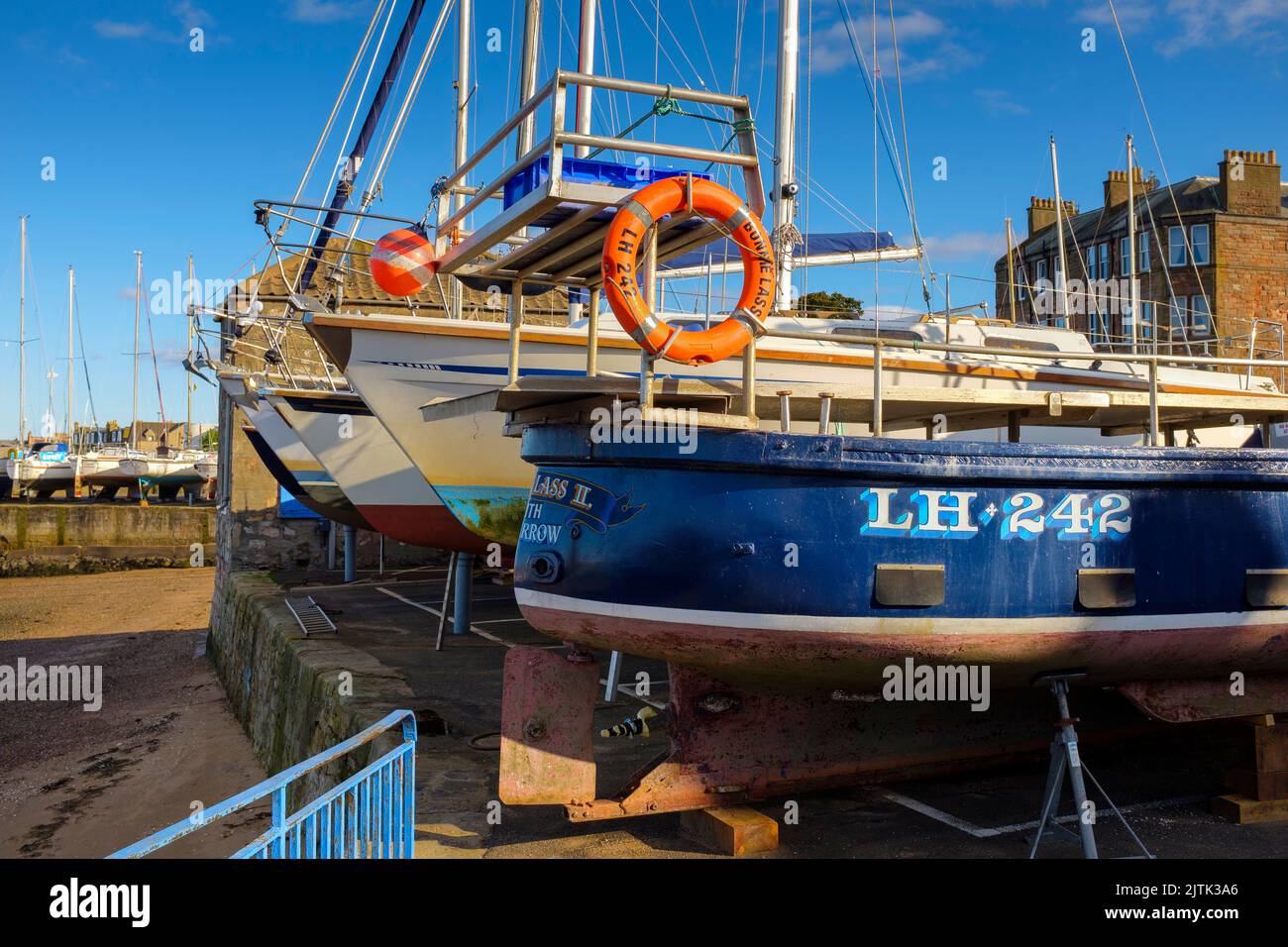 Boats on the quayside at Fisherrow Harbour, Musselburgh, Scotland, UK Stock Photo