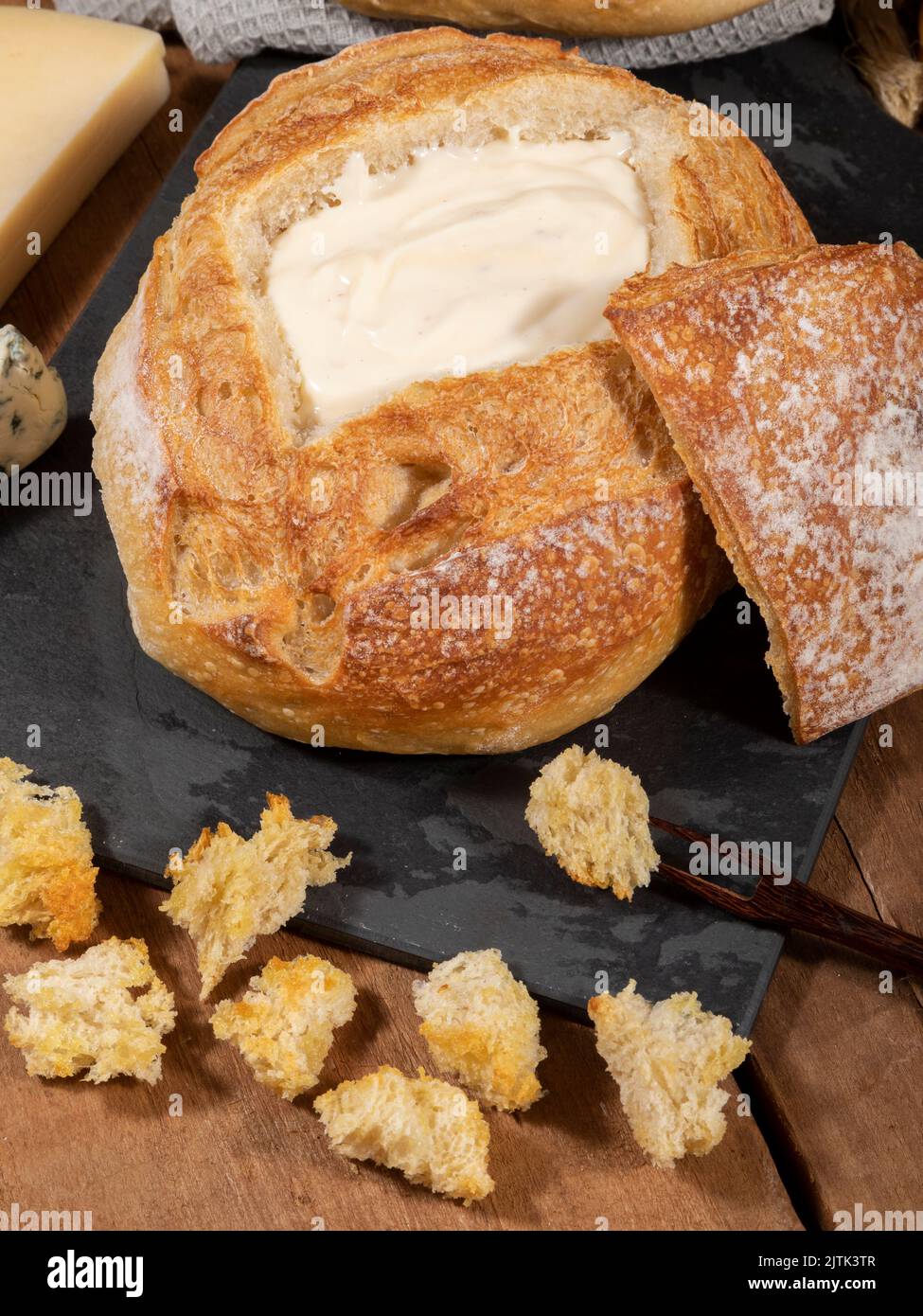 Cream cheese inside Italian bread with croutons, fondue Stock Photo Alamy