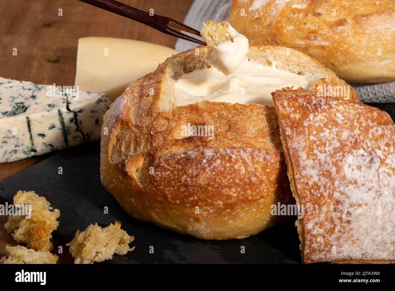 Cream cheese inside Italian bread with croutons, fondue Stock Photo Alamy