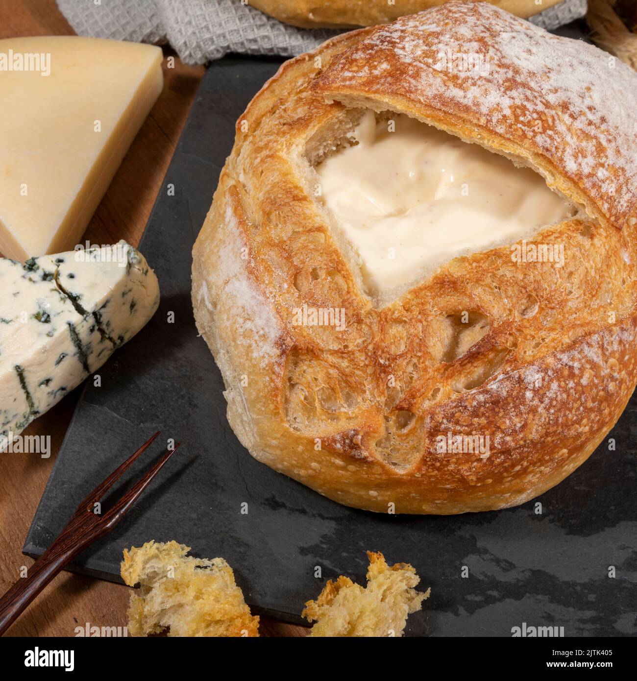 Cream cheese inside Italian bread with croutons, fondue Stock Photo Alamy