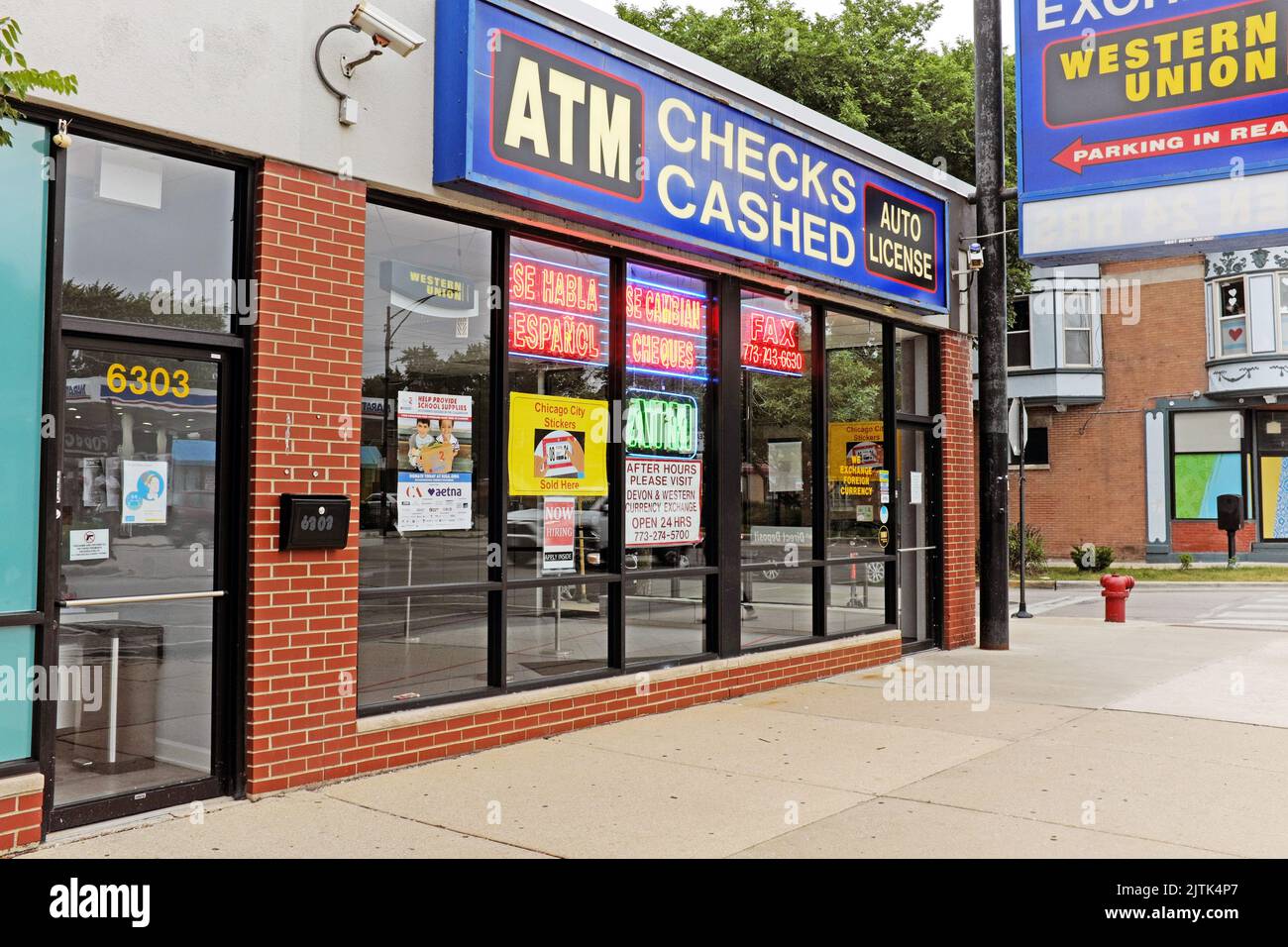 A check cashing store in Chicago, Illinois with the Western Union sign hanging on the outside on July 16, 2022. Stock Photo