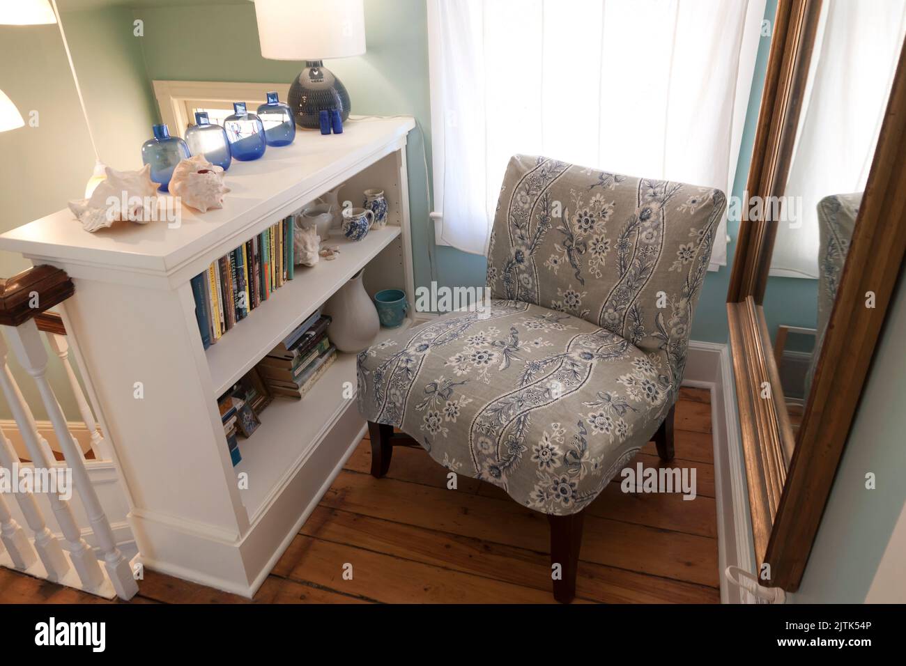 A house's furnished/decorated upstairs hallway landing area Stock Photo