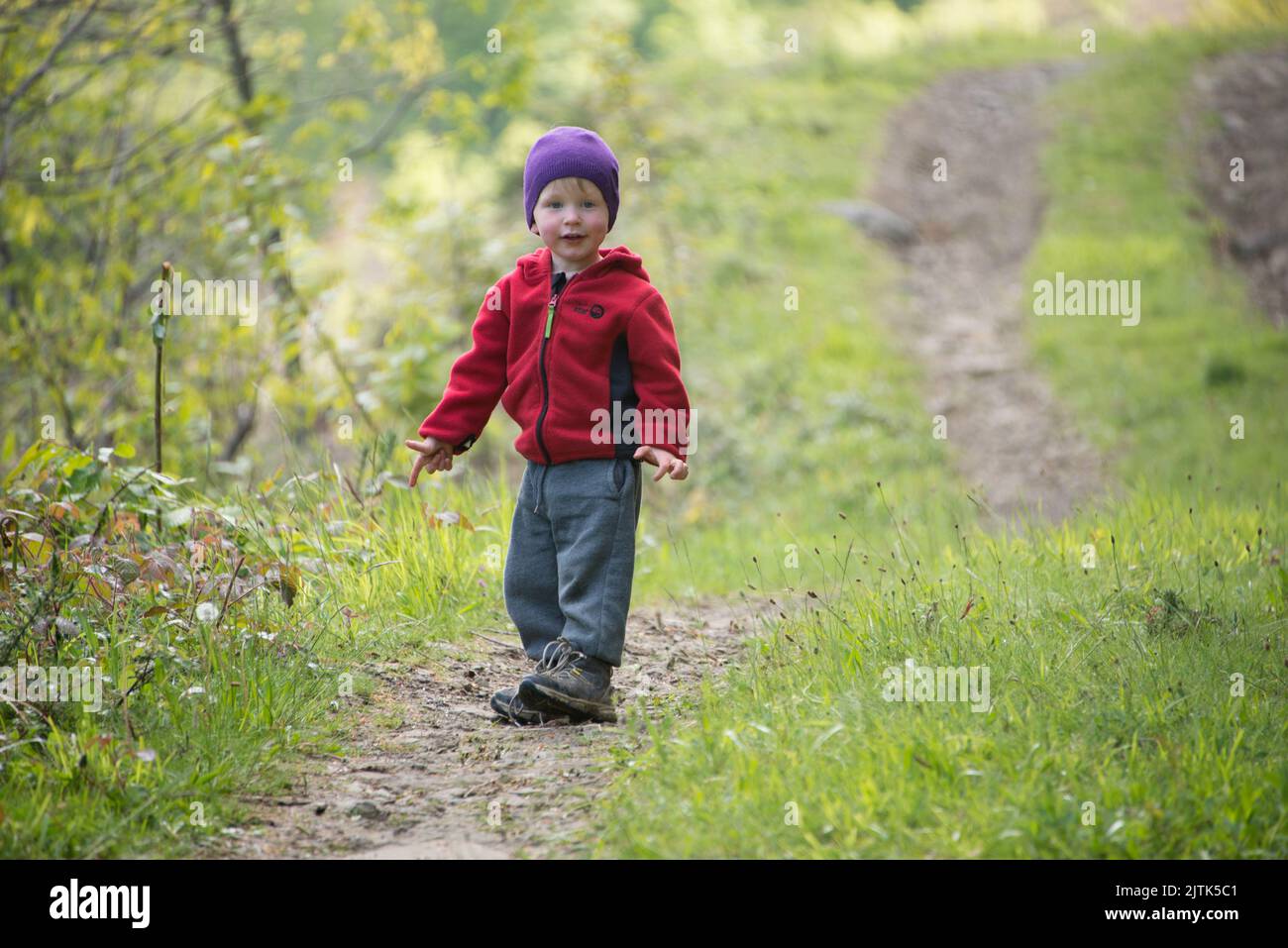 Toddler walking in Spanish foothills of Navarra. Stock Photo