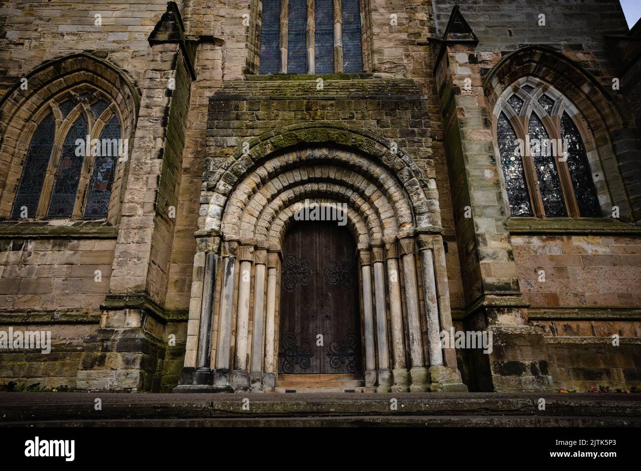 an-ancient-wooden-door-of-dunfermline-castle-framed-by-stones-in