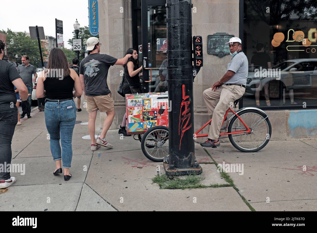 People on the sidewalks of Andersonville, Chicago, Illinois, create a lively streetscape. Stock Photo