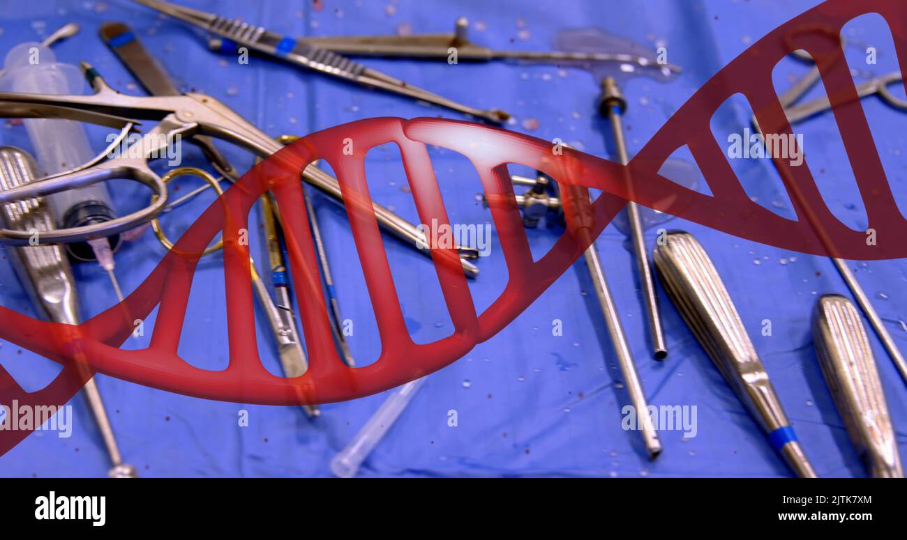 Image of dna strand over surgical instruments Stock Photo