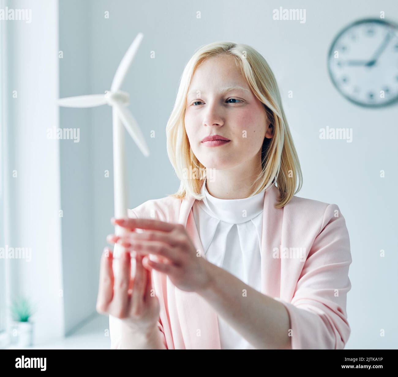 business woman portrait office businesswoman young windmill energy environment electricity power innovation model ecology renewable eco green Stock Photo