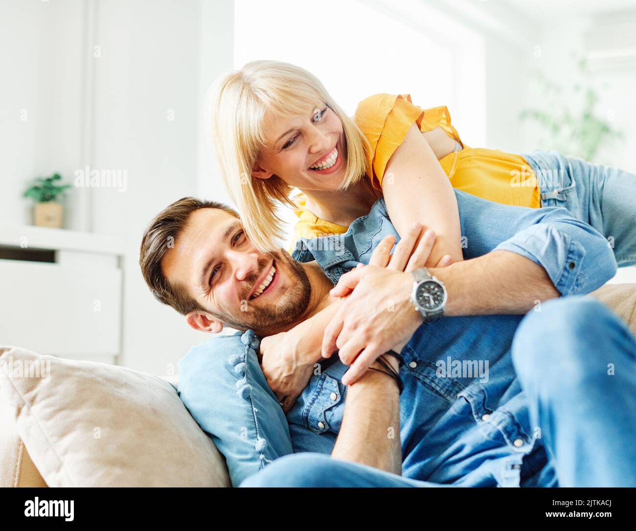 woman couple man happy happiness love young lifestyle together romantic boyfriend girlfriend romance boyfriend girlfriend home fun Stock Photo