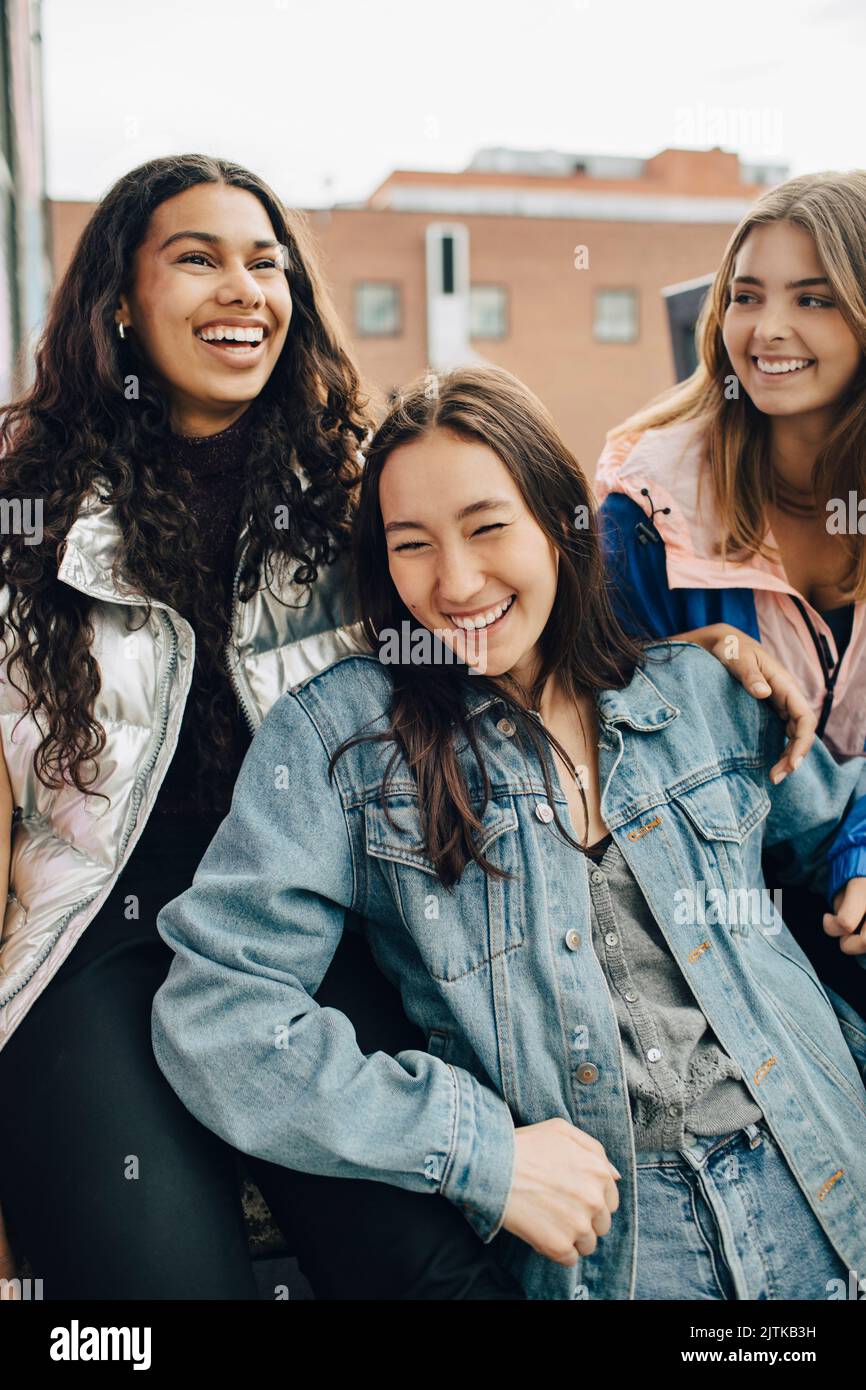 Cheerful multiracial young friends spending having fun together Stock Photo