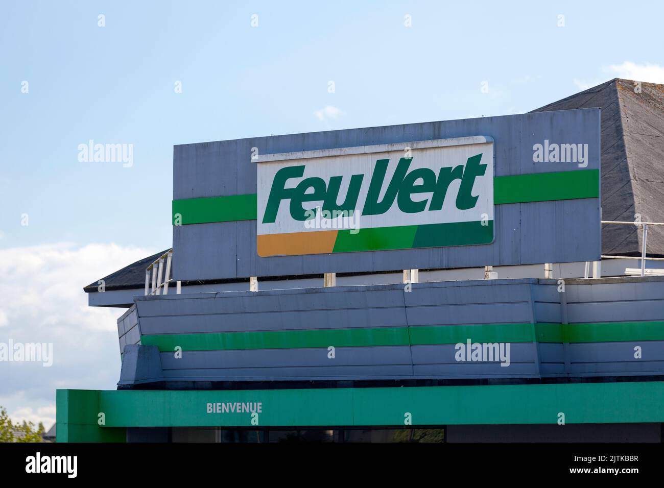 Saint-Martin-des-Champs, France - August, 24 2022: Sign of Feu Vert, French company specializing in the maintenance and sale of car accessories. Stock Photo