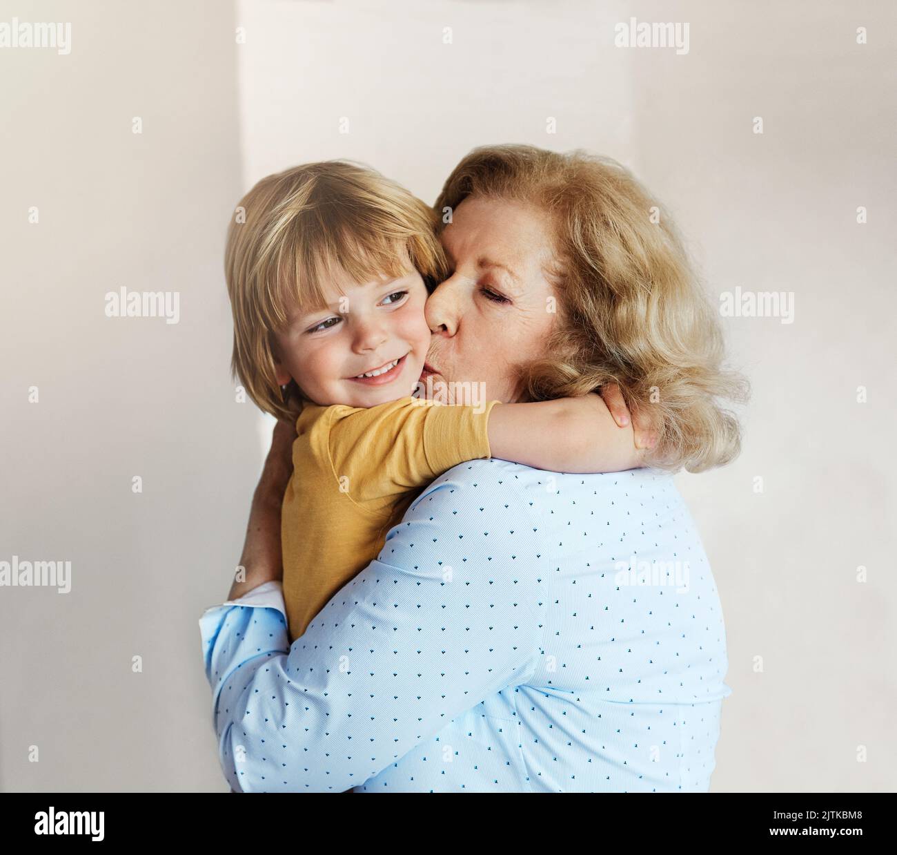 grandchild grandson grandma grandmother portrait boy senior love family bondingson hugging hug Stock Photo