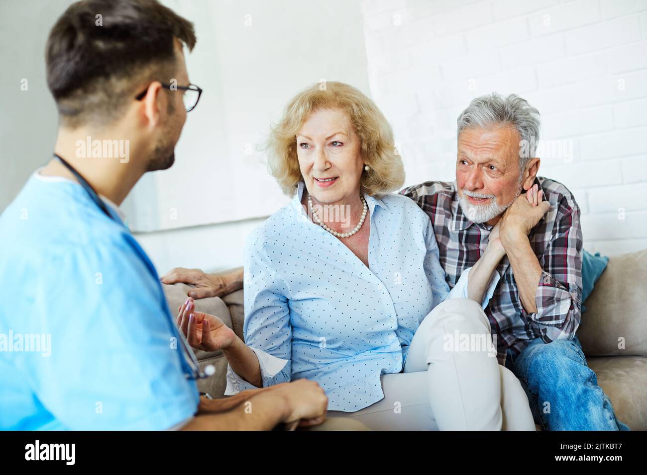 nurse doctor senior couple care caregiver help assistence retirement home nursing elderly man