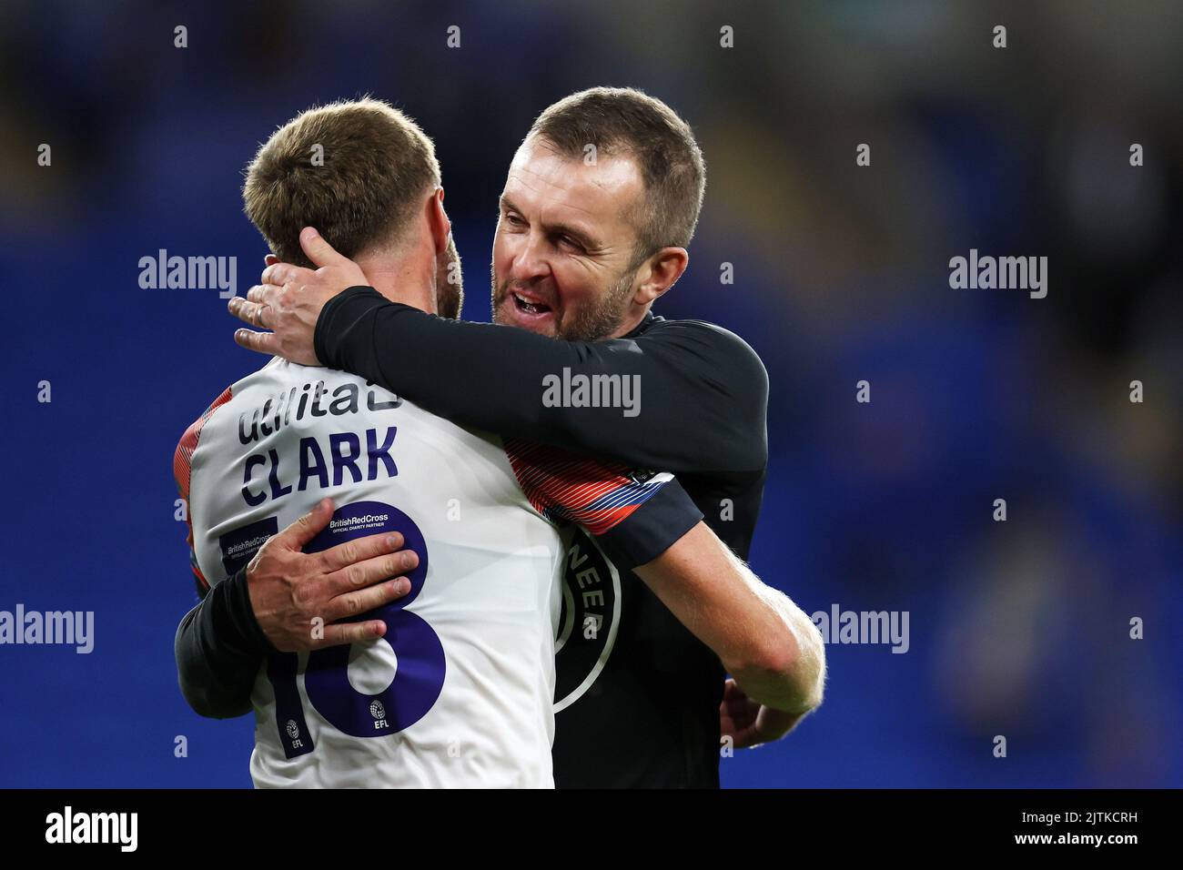 Cardiff, UK. 30th Aug, 2022. Nathan Jones, the manager of Luton Town celebrates with Jordan Clarke (18) of Luton Town at the end of the match. EFL Skybet championship match, Cardiff city v Luton Town at the Cardiff City Stadium in Cardiff, Wales on Tuesday 30th August 2022. this image may only be used for Editorial purposes. Editorial use only, license required for commercial use. No use in betting, games or a single club/league/player publications. pic by Andrew Orchard/Andrew Orchard sports photography/Alamy Live news Credit: Andrew Orchard sports photography/Alamy Live News Stock Photo