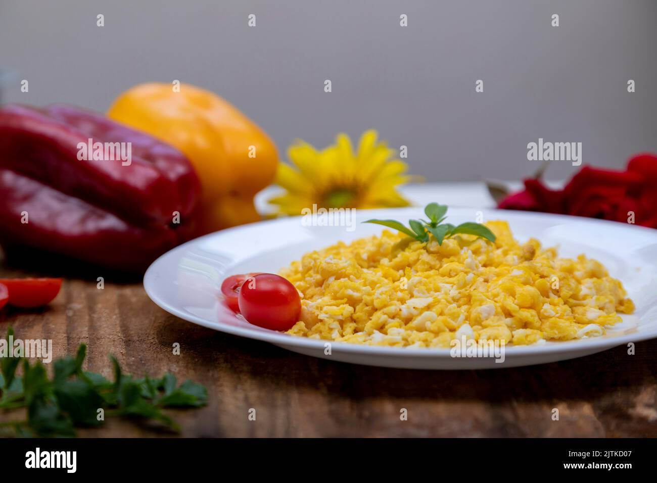 fresh scrambled eggs on white plate on breakfast table Stock Photo - Alamy