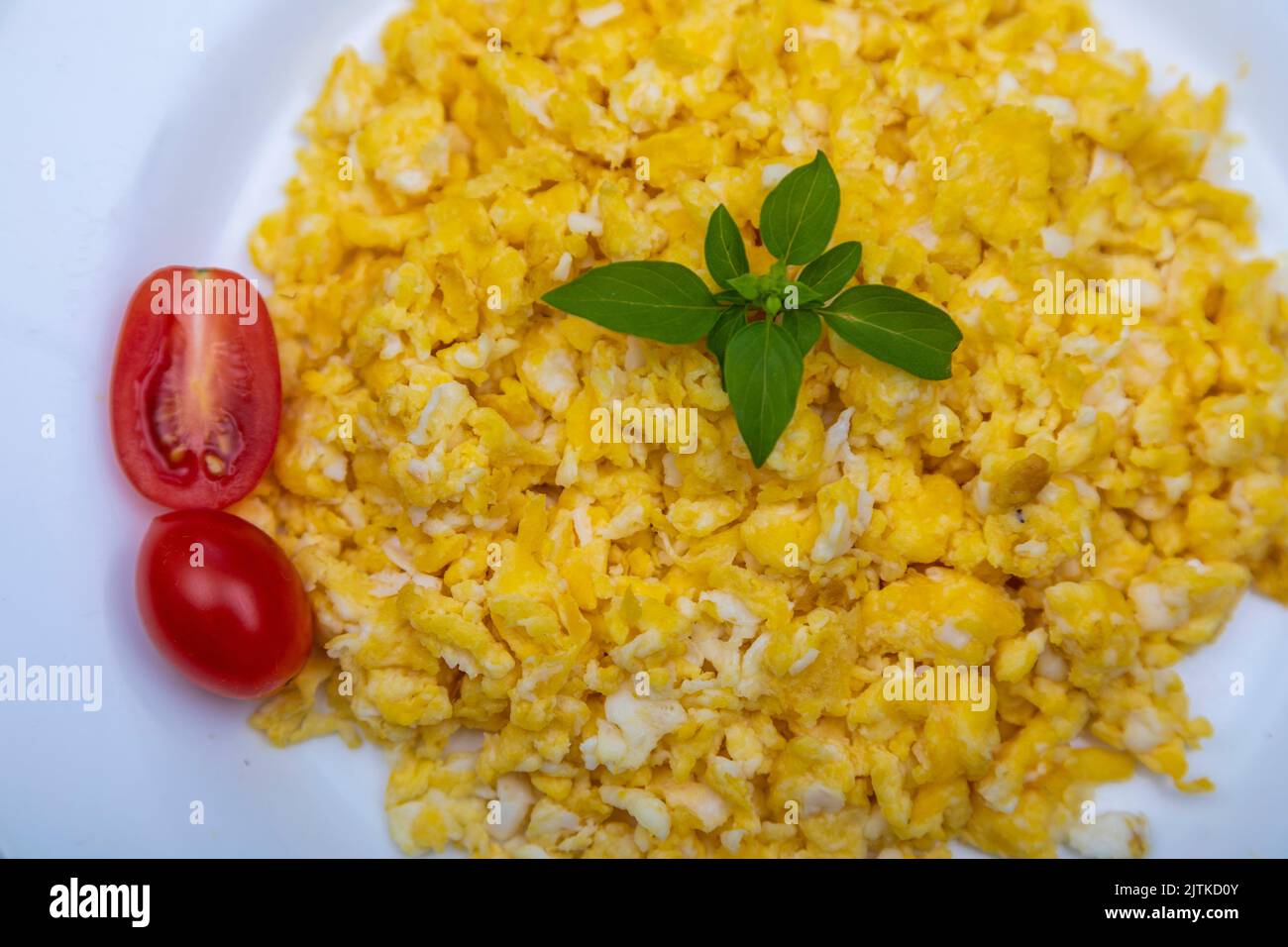 Scrambled egg on white plate Stock Photo - Alamy