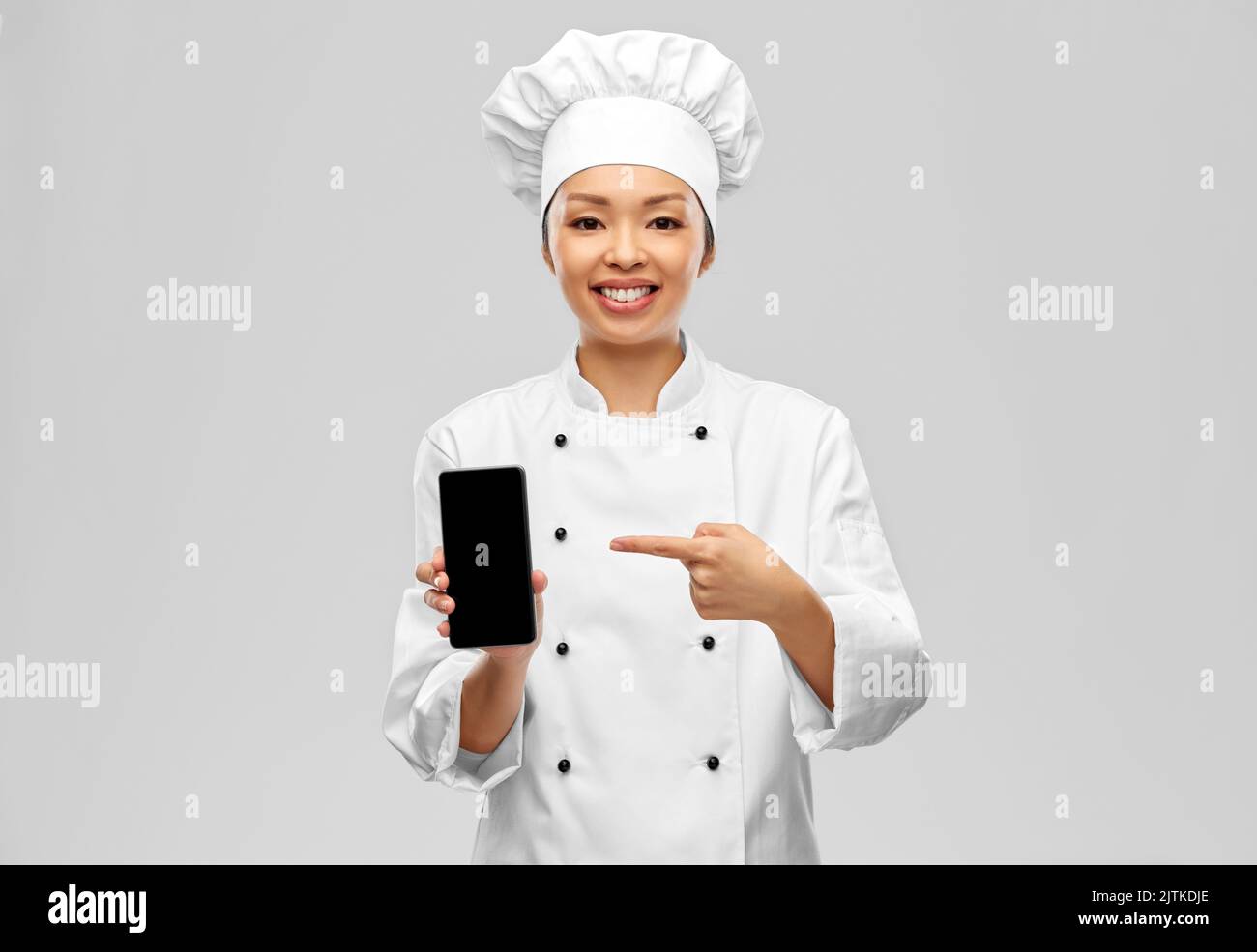 Chef Phone Smiling female chef smartphone hi-res stock photography and images - Alamy