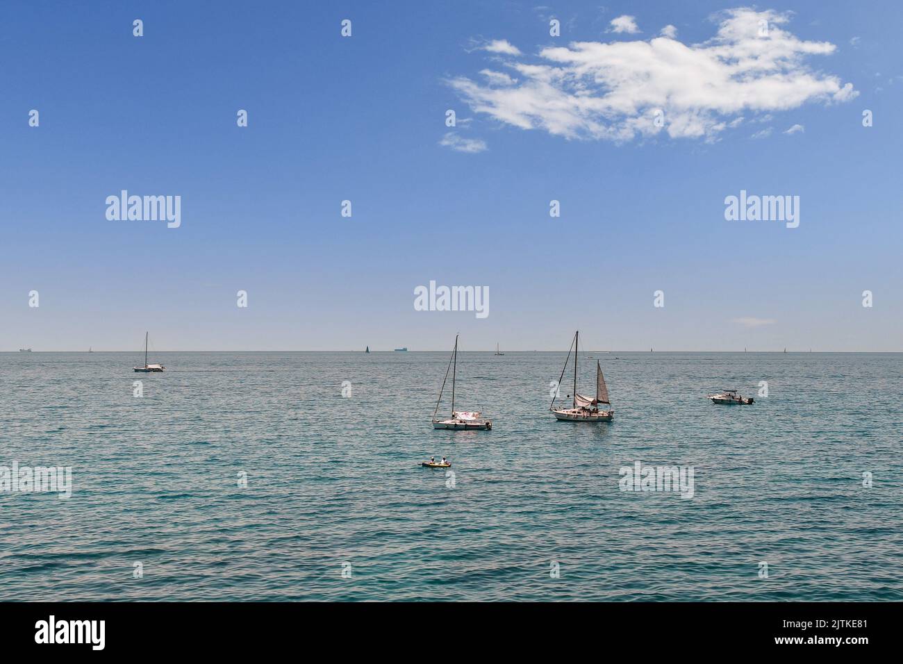 Seascape with sailboats at sea in the Paradise Gulf in a sunny summer day, Nervi, Genoa, Liguria, Italy Stock Photo