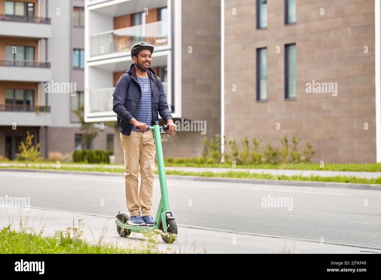 Happy man on scooter hi-res stock photography and images - Alamy