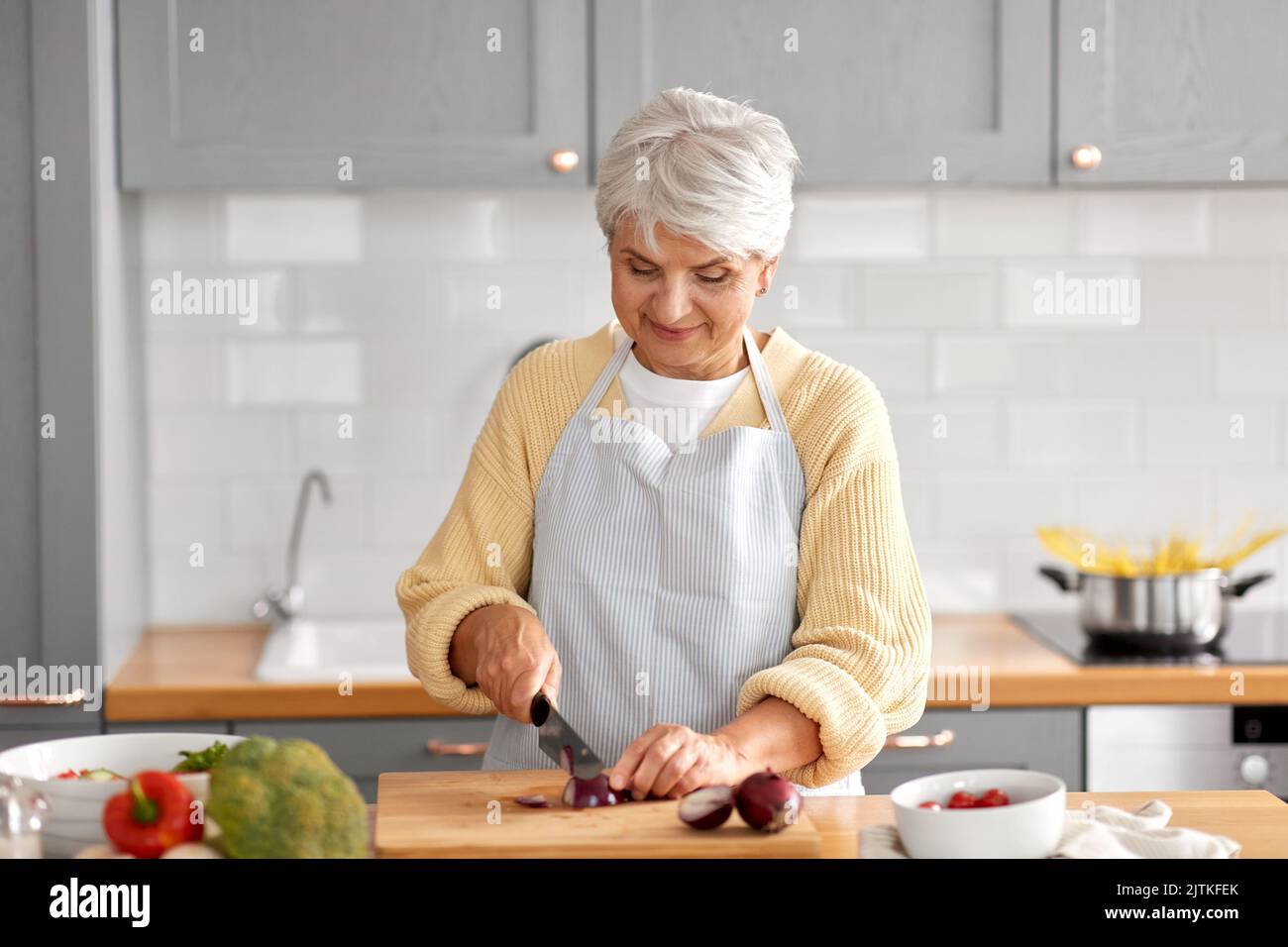 Woman cutting red onion on hi-res stock photography and images - Alamy